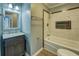 Bathroom featuring a tub, shower, and neutral walls with gray and white tile at 1103 Wallington Nw Ct, Conyers, GA 30012