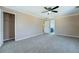 Bright bedroom boasts neutral paint, plush carpeting, ceiling fan, and an ensuite bathroom at 1103 Wallington Nw Ct, Conyers, GA 30012