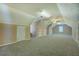 Large bonus room featuring built-in cabinets, plush carpeting, and unique architecture at 1103 Wallington Nw Ct, Conyers, GA 30012