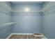 Walk-in closet with wire shelving and laminate flooring, ready for organized storage at 1103 Wallington Nw Ct, Conyers, GA 30012