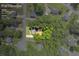 Aerial view of property showcasing the home, surrounding trees, and lot lines on 0.47 acres at 187 Gilberts Way, Temple, GA 30179