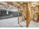 Unfinished basement with concrete floor, insulation, framed walls, and water heater at 187 Gilberts Way, Temple, GA 30179