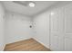 Unfinished basement space featuring wood-look flooring, white walls, and lighting at 187 Gilberts Way, Temple, GA 30179