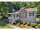 Attractive home with stone detailing and inviting front porch, framed by lush greenery and landscaped yard at 187 Gilberts Way, Temple, GA 30179