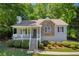 Charming home with a stone accent and a welcoming front porch in a serene, wooded setting at 187 Gilberts Way, Temple, GA 30179
