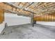 Spacious garage with concrete floor, insulated ceiling, garage door, and utility connections at 187 Gilberts Way, Temple, GA 30179