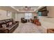 Wide view of the finished basement with media area, office space, and large decorative rug at 262 Sandhurst Ct, Suwanee, GA 30024