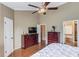 Spacious bedroom with hardwood floors, a ceiling fan, and ample closet space at 262 Sandhurst Ct, Suwanee, GA 30024