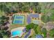 Aerial view of community amenities including a pool, tennis courts, basketball court, and playground at 262 Sandhurst Ct, Suwanee, GA 30024