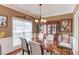 Elegant dining room featuring hardwood floors, crown molding, and ample natural light at 262 Sandhurst Ct, Suwanee, GA 30024