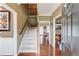 Welcoming foyer with hardwood floors, staircase, and entry to adjacent rooms at 262 Sandhurst Ct, Suwanee, GA 30024