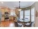 Eat-in kitchen features granite countertops, stainless steel appliances, and a charming breakfast nook with lots of natural light at 262 Sandhurst Ct, Suwanee, GA 30024