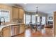 Bright and airy kitchen boasting granite countertops, stainless steel appliances, and a cozy breakfast table at 262 Sandhurst Ct, Suwanee, GA 30024