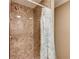 A close-up view of a tiled shower with new fixtures at 262 Sandhurst Ct, Suwanee, GA 30024