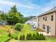 Picturesque backyard featuring a lush lawn, mature trees, and a charming playhouse at 2887 Regal Park Ct, Duluth, GA 30096