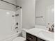 Standard bathroom featuring a shower-tub combo, toilet, and vanity with dark wood cabinets at 2887 Regal Park Ct, Duluth, GA 30096