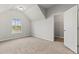 Comfortable bedroom with large window, angled ceiling, and a walk-in closet, offering ample natural light at 2887 Regal Park Ct, Duluth, GA 30096