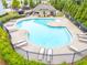 Community swimming pool featuring ample lounging chairs on the concrete deck and well-maintained landscaping at 2887 Regal Park Ct, Duluth, GA 30096