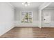 Airy dining room with hardwood floors, large window, and traditional lighting fixture at 2887 Regal Park Ct, Duluth, GA 30096