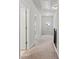Bright hallway with neutral carpet and paint featuring access to other rooms at 2887 Regal Park Ct, Duluth, GA 30096