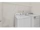 Laundry area featuring a white washer and dryer at 2887 Regal Park Ct, Duluth, GA 30096