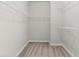 Spacious walk-in closet featuring wire shelving and neutral carpeting, offering ample storage at 2887 Regal Park Ct, Duluth, GA 30096