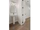 Modern bathroom featuring a pedestal sink, sleek fixtures, and stylish lighting at 4002 Potter Way, Woodstock, GA 30188