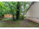 Lush backyard with green foliage features wooden fencing for added privacy at 2045 Scarbrough Dr, Stone Mountain, GA 30088