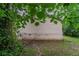 The backyard has a traditional design with greenery and a wooden fence at 2045 Scarbrough Dr, Stone Mountain, GA 30088
