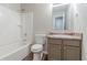 Bathroom featuring a shower/tub combo, toilet, and vanity with faux marble top at 2045 Scarbrough Dr, Stone Mountain, GA 30088