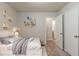 Stylishly staged bedroom featuring neutral decor and carpeting for a cozy aesthetic at 2045 Scarbrough Dr, Stone Mountain, GA 30088