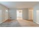 Open-concept living room with new carpet flooring, neutral paint, and an abundance of natural light at 2045 Scarbrough Dr, Stone Mountain, GA 30088