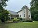 Beautiful home featuring a covered front porch and a well-maintained lawn at 2377 Centerville Rosebud Rd, Loganville, GA 30052