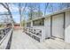 Large wooden back deck with grey railings offers a tranquil outdoor space at 2826 Ben Hill Rd, Atlanta, GA 30344