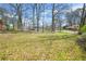 A well-manicured, expansive green backyard offers ample space for outdoor activities and relaxation at 2826 Ben Hill Rd, Atlanta, GA 30344