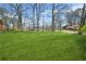 A well-manicured, expansive green backyard offers ample space for outdoor activities and relaxation at 2826 Ben Hill Rd, Atlanta, GA 30344