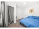 Bedroom with a closet, white door, and modern cactus artwork at 2826 Ben Hill Rd, Atlanta, GA 30344