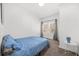 Cozy bedroom with carpet, a sunny window, and a small side table at 2826 Ben Hill Rd, Atlanta, GA 30344