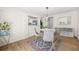 Dining room with modern chairs, a round table, and hardwood floors at 2826 Ben Hill Rd, Atlanta, GA 30344