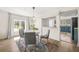 Bright dining room with modern chairs, a round table, and hardwood floors at 2826 Ben Hill Rd, Atlanta, GA 30344