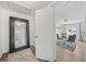 Inviting entryway featuring a large mirror and an open view into the dining area at 2826 Ben Hill Rd, Atlanta, GA 30344