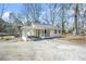 Charming single-story home with covered carport and long driveway at 2826 Ben Hill Rd, Atlanta, GA 30344