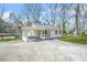 Charming single-story home with covered carport and long driveway at 2826 Ben Hill Rd, Atlanta, GA 30344