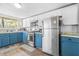 Kitchen with stainless steel appliances, wood-style floors, and ample natural light at 2826 Ben Hill Rd, Atlanta, GA 30344
