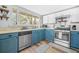 Well-lit kitchen featuring stainless steel appliances and wood-style flooring at 2826 Ben Hill Rd, Atlanta, GA 30344