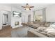 Living room with hardwood floors, fireplace, and a large sectional sofa at 2826 Ben Hill Rd, Atlanta, GA 30344