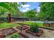 Spacious backyard with a pool, garden, and patio perfect for outdoor entertaining and relaxation at 3580 Raymond Dr, Atlanta, GA 30340