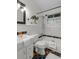 Bathroom with sink, toilet, and bathtub with multi colored accents and glass block window at 3580 Raymond Dr, Atlanta, GA 30340