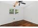 Bedroom with hardwood floors and natural light with a modern ceiling fan at 3580 Raymond Dr, Atlanta, GA 30340