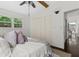 Cozy bedroom with natural light from a double window and spacious closet at 3580 Raymond Dr, Atlanta, GA 30340